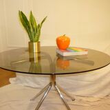 Table vintage 70 en verre légèrement fumé pieds chromés