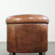 Vintage sheepskin club armchair in English style with deep colours