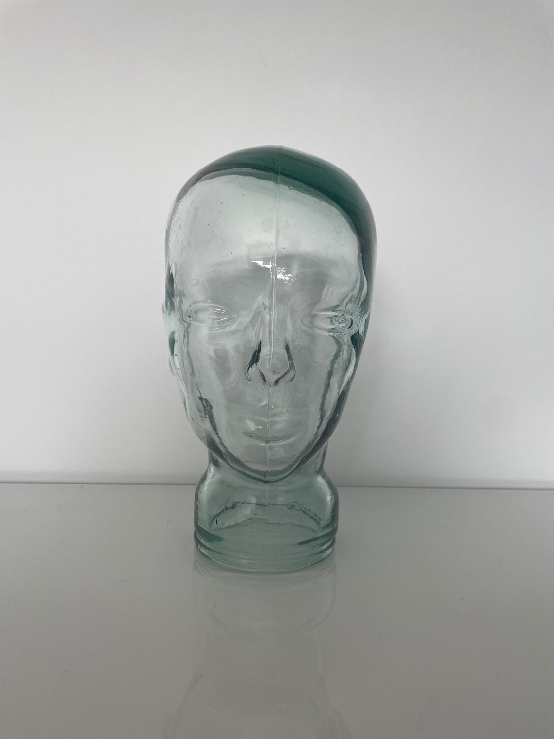 Mannequin head with glass hat