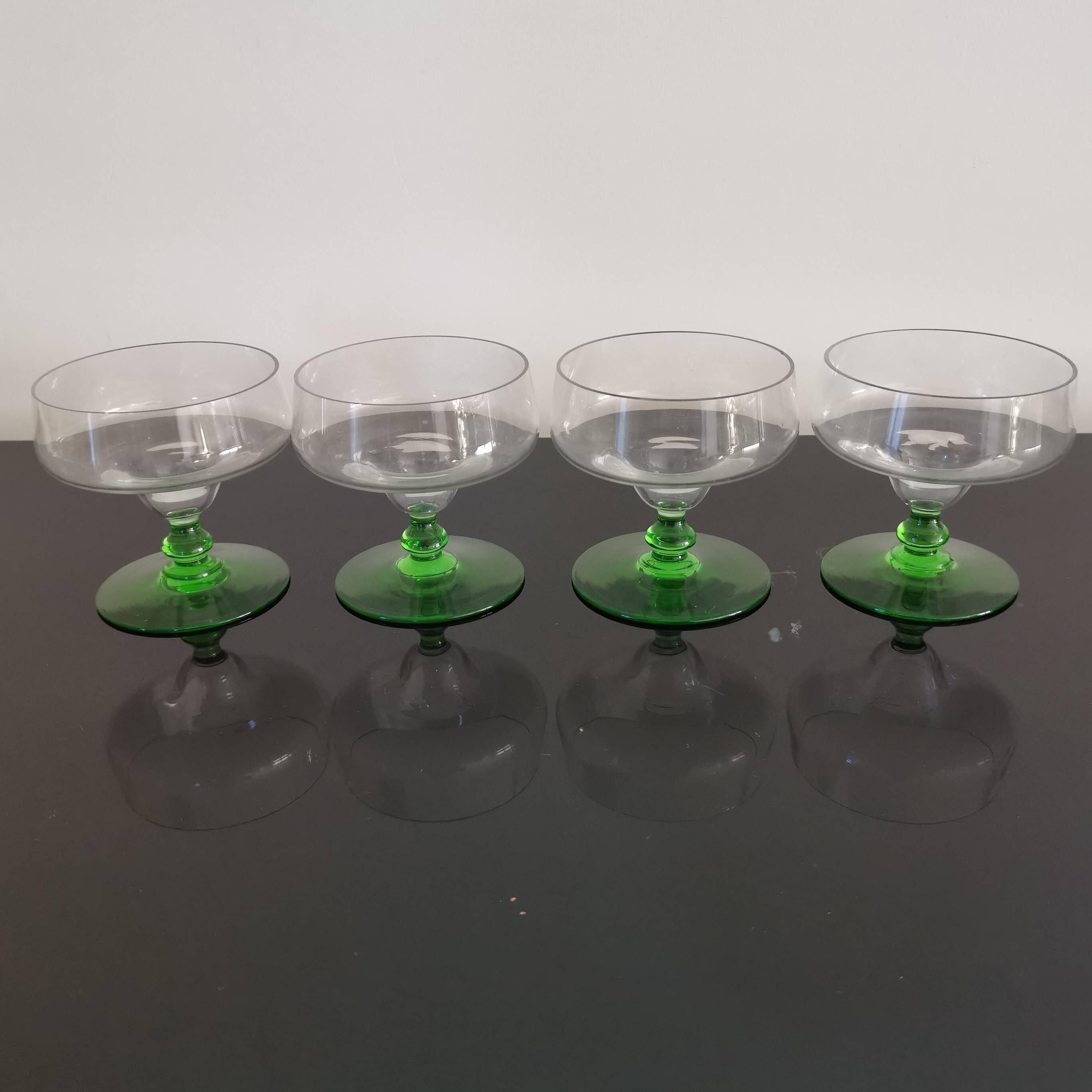 Set of 4 champagne glasses on green legs, 1960s