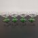 Set of 4 champagne glasses on green legs, 1960s