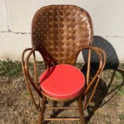 Vintage 1970s armchair in curved woven chestnut + seat cushion