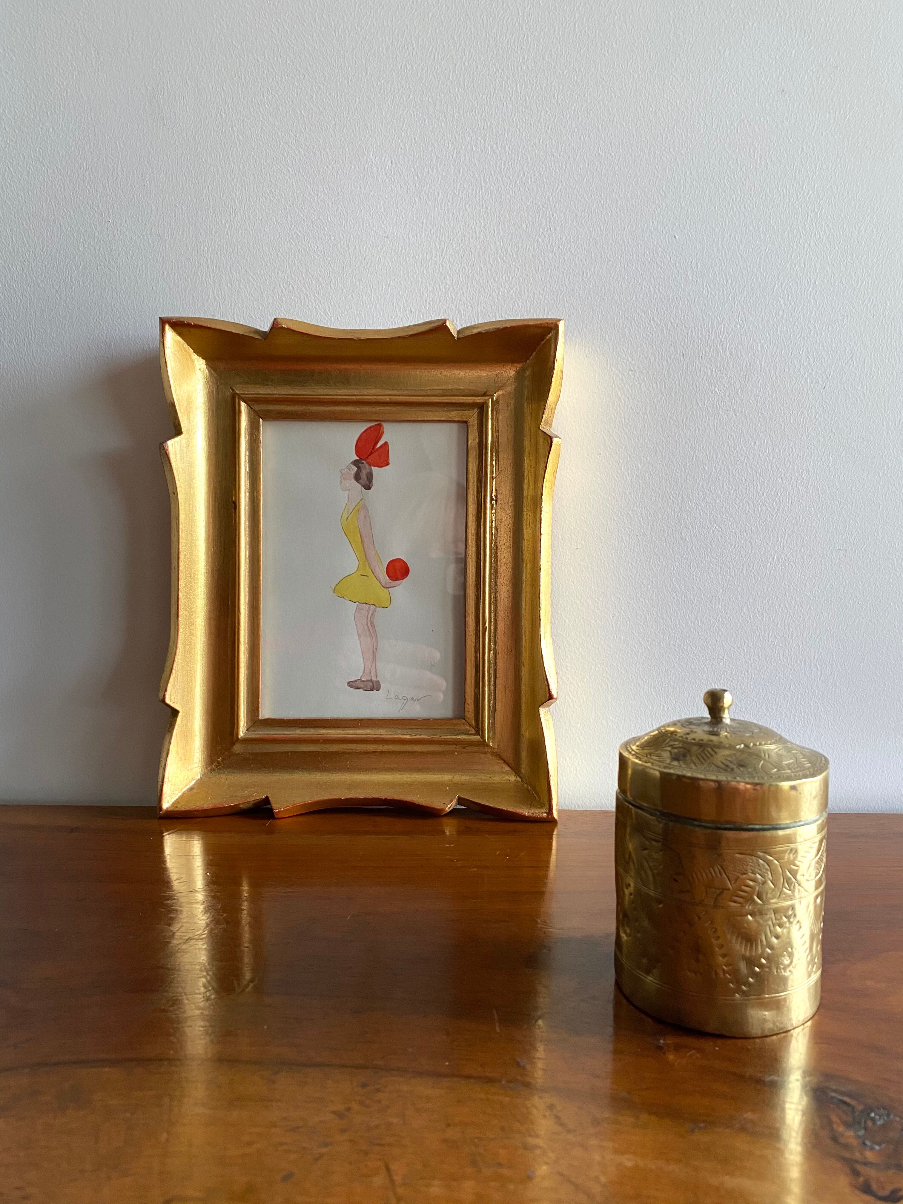 Old round box in chiseled brass
