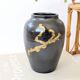 Vintage ceramic vase, black and gold, Japandi style