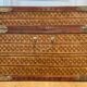 Beautiful vintage Chinese trunk in wicker, black and gold lacquered wood, and brass.
