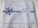 Embroidered single bedspread YM with blue knotted ribbon.