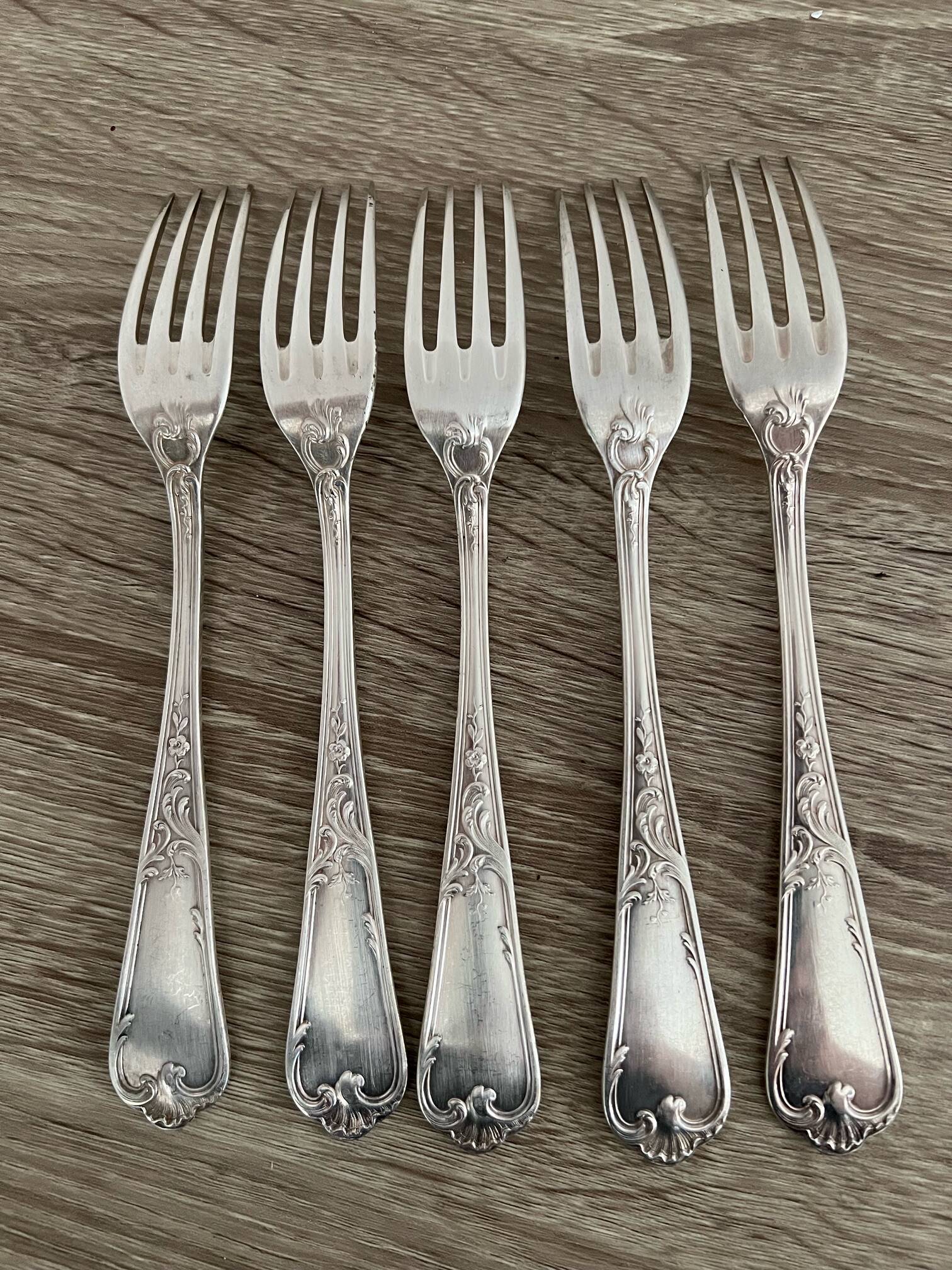 5 silver-plated metal forks with the Ercuis hallmark.
