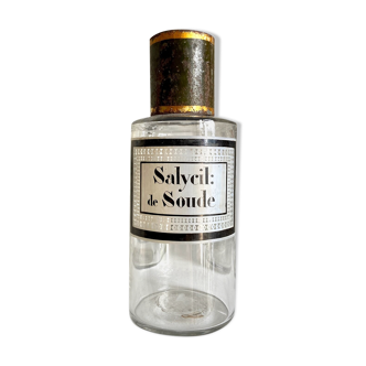 Salycil apothecary bottle: soda in transparent glass and green metal