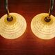 Pair of brass and yellow/white speckled glass wall sconces