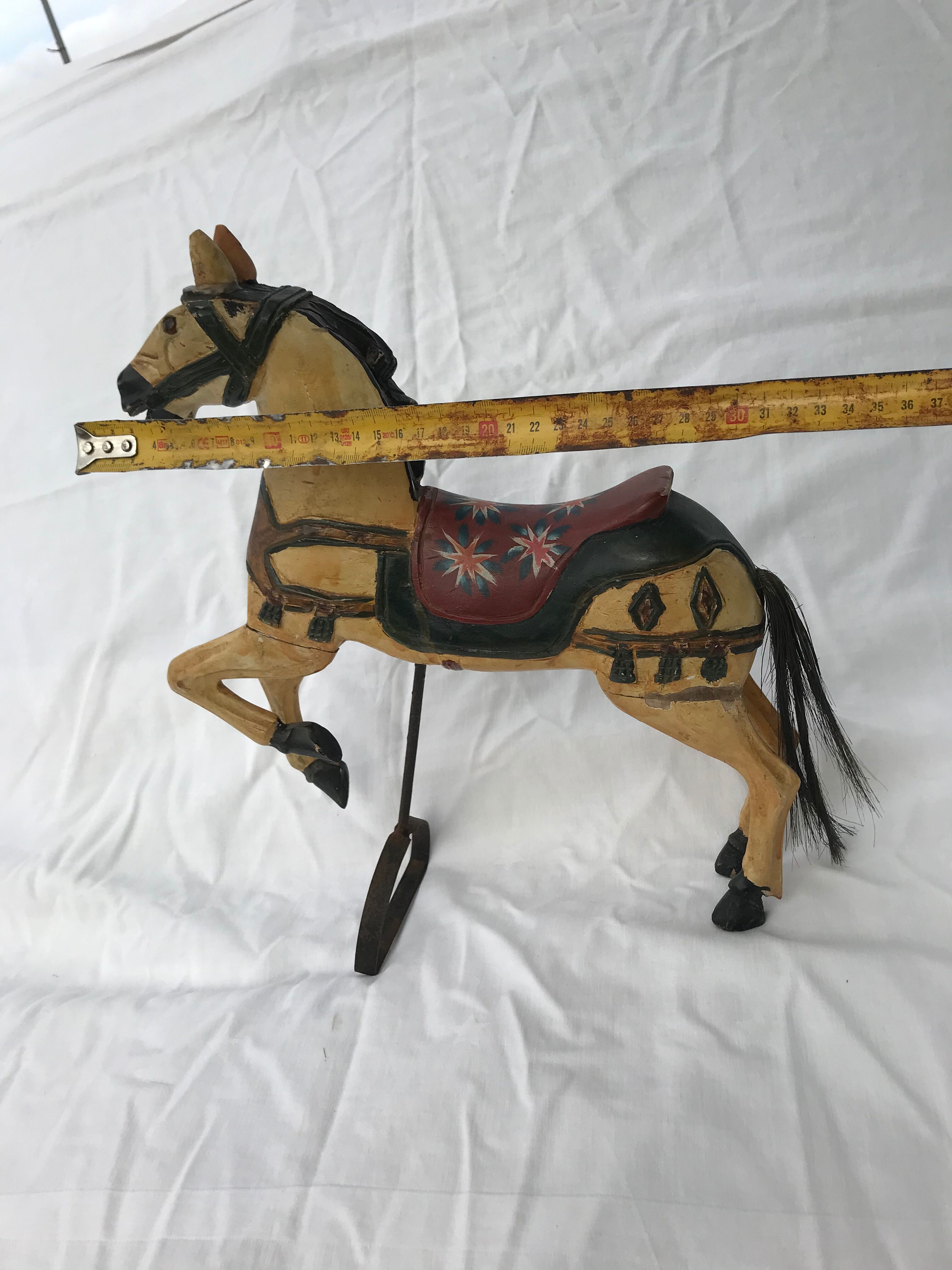Wooden horse with period ironwork support