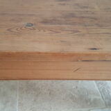 Church bench in fir tree with armrests