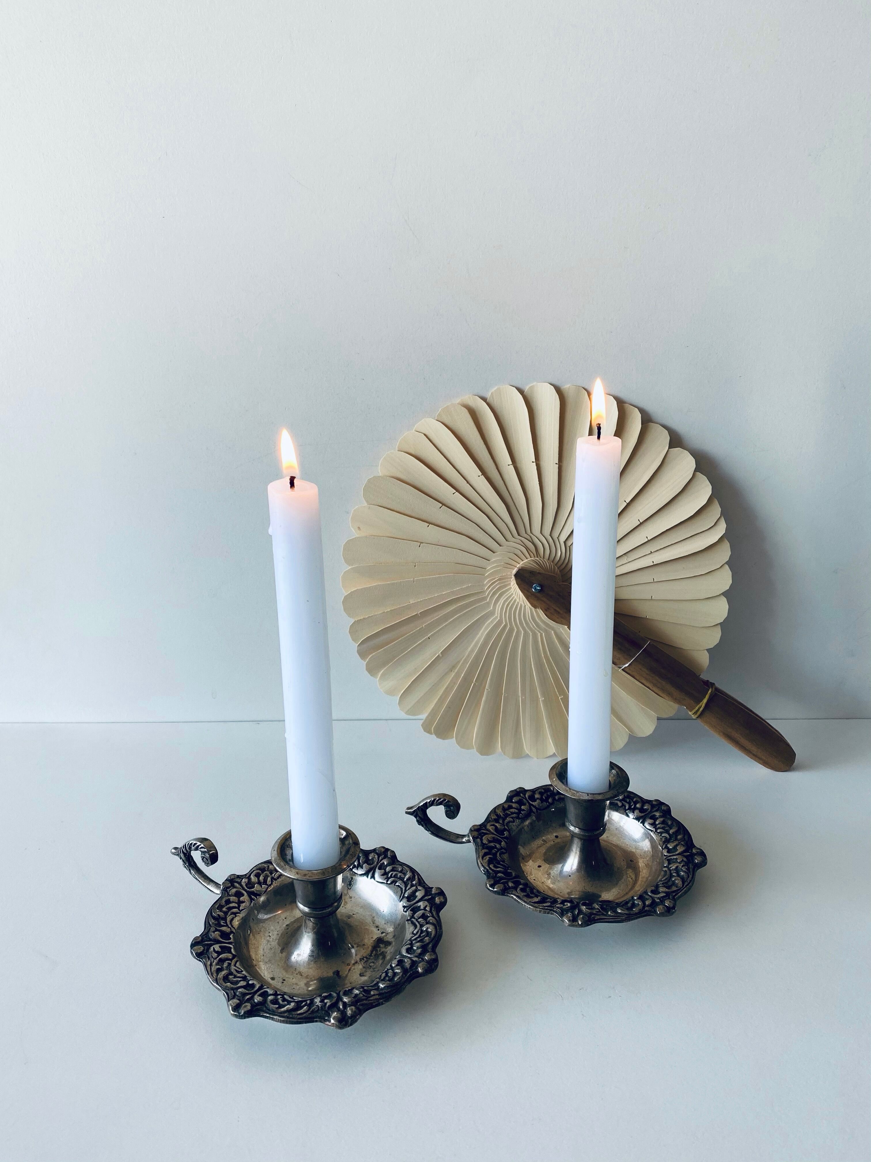Pair of silver metal candlesticks