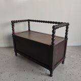 Natural wood chest forming a bench, ringed shoulders