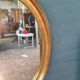 Pair of golden oval mirrors