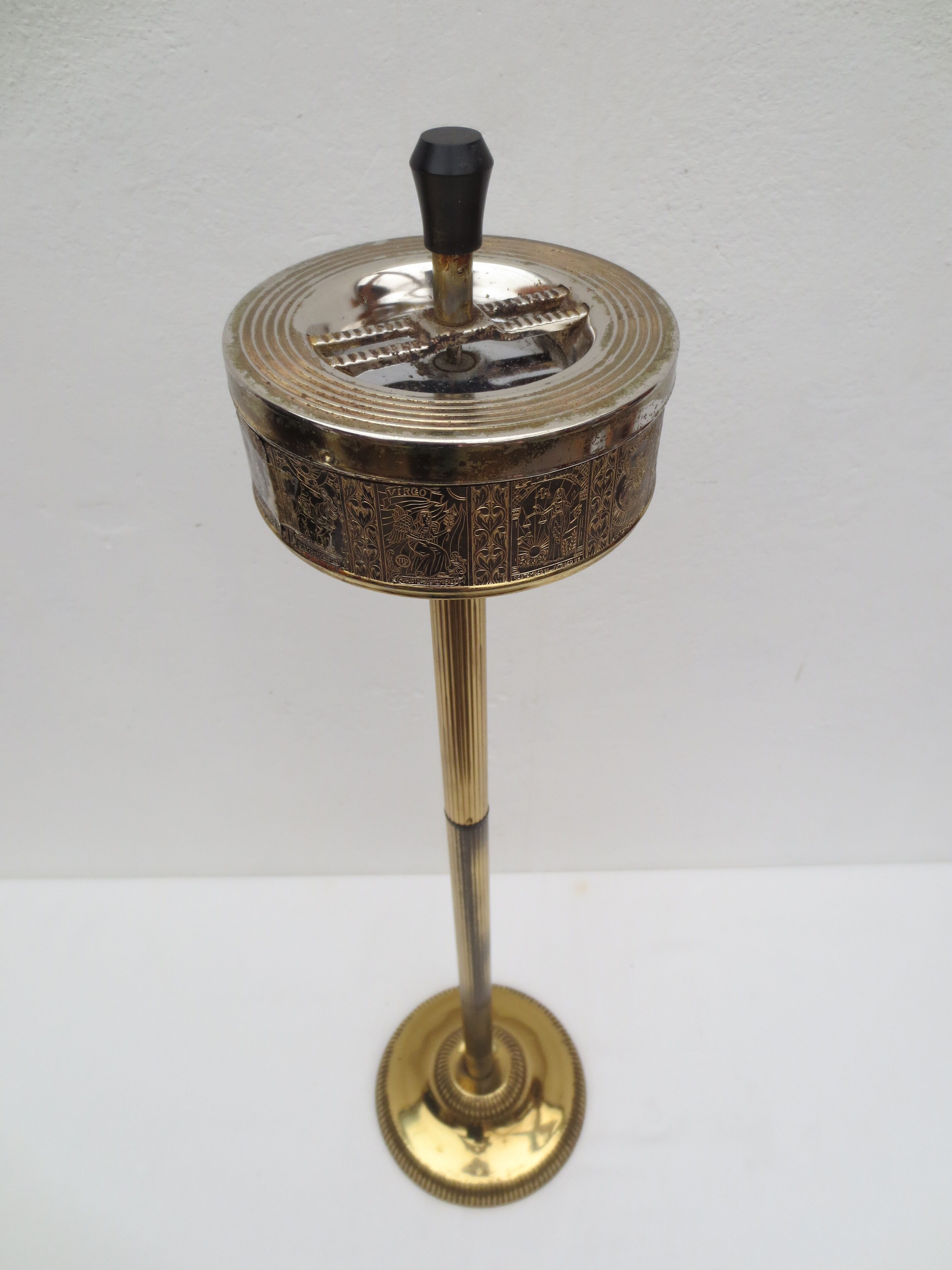 Old ashtray on foot year 50 in gilded brass