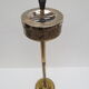 Old ashtray on foot year 50 in gilded brass