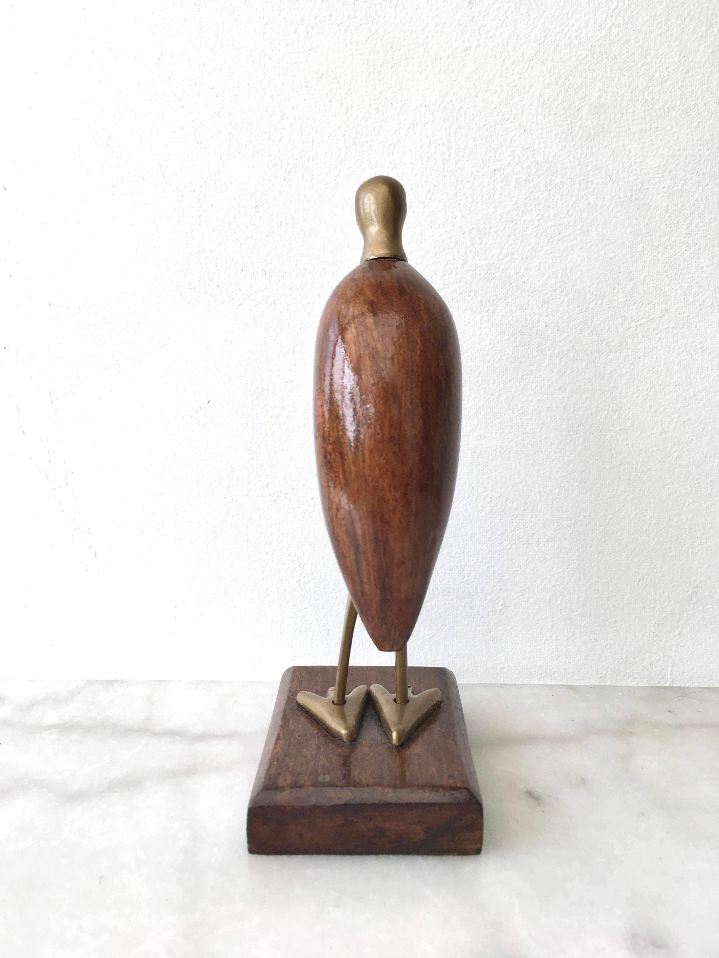 Animal marabout in teak and brass