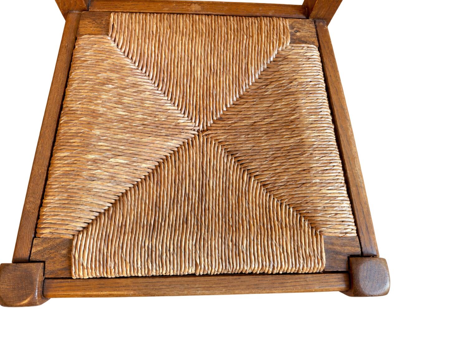 Set of 6 wooden chairs with straw seats and high backs.