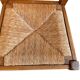 Set of 6 wooden chairs with straw seats and high backs.