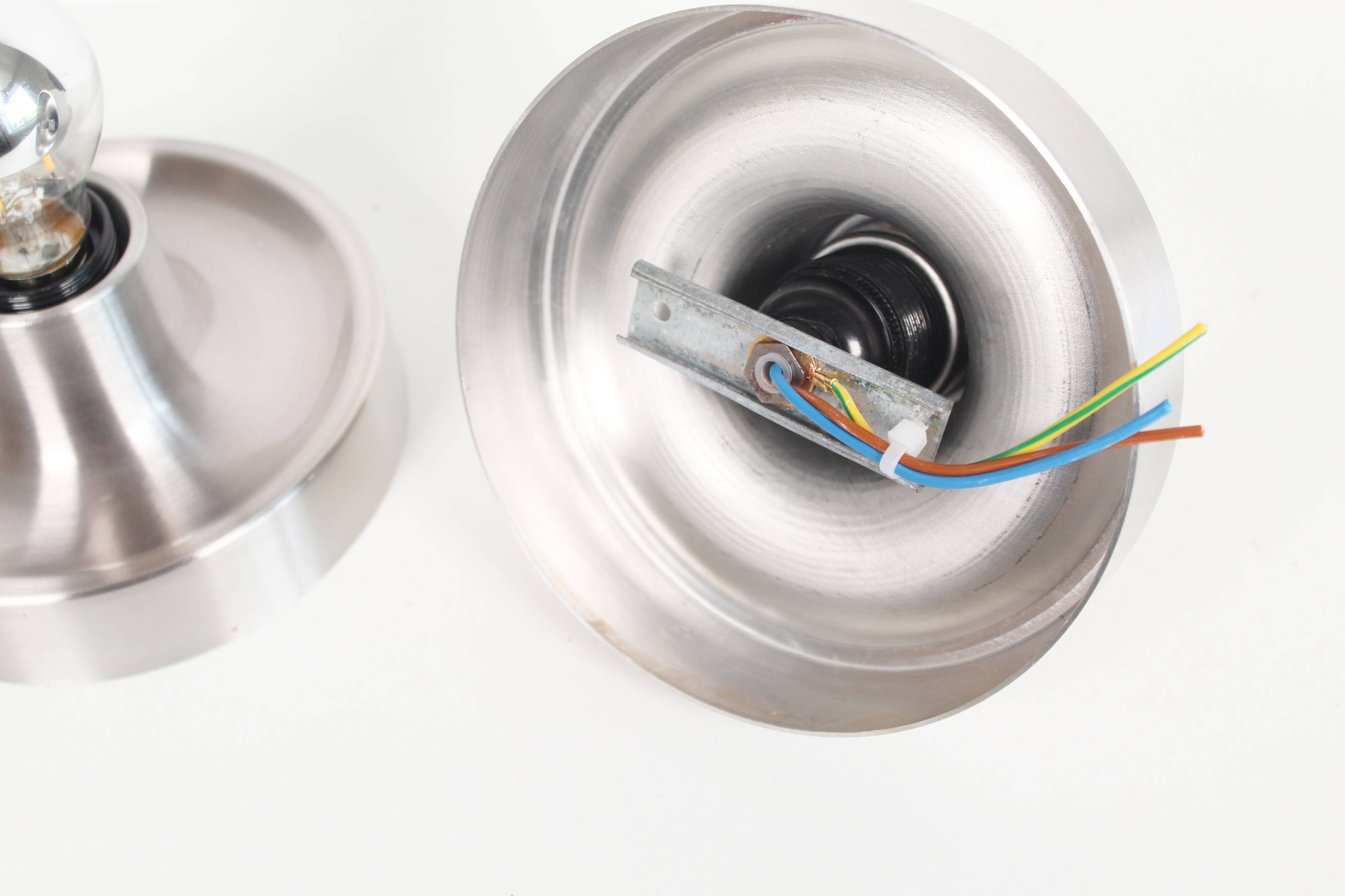 Pair of petite Disc sconces selected by Charlotte Perriand for Les Arcs