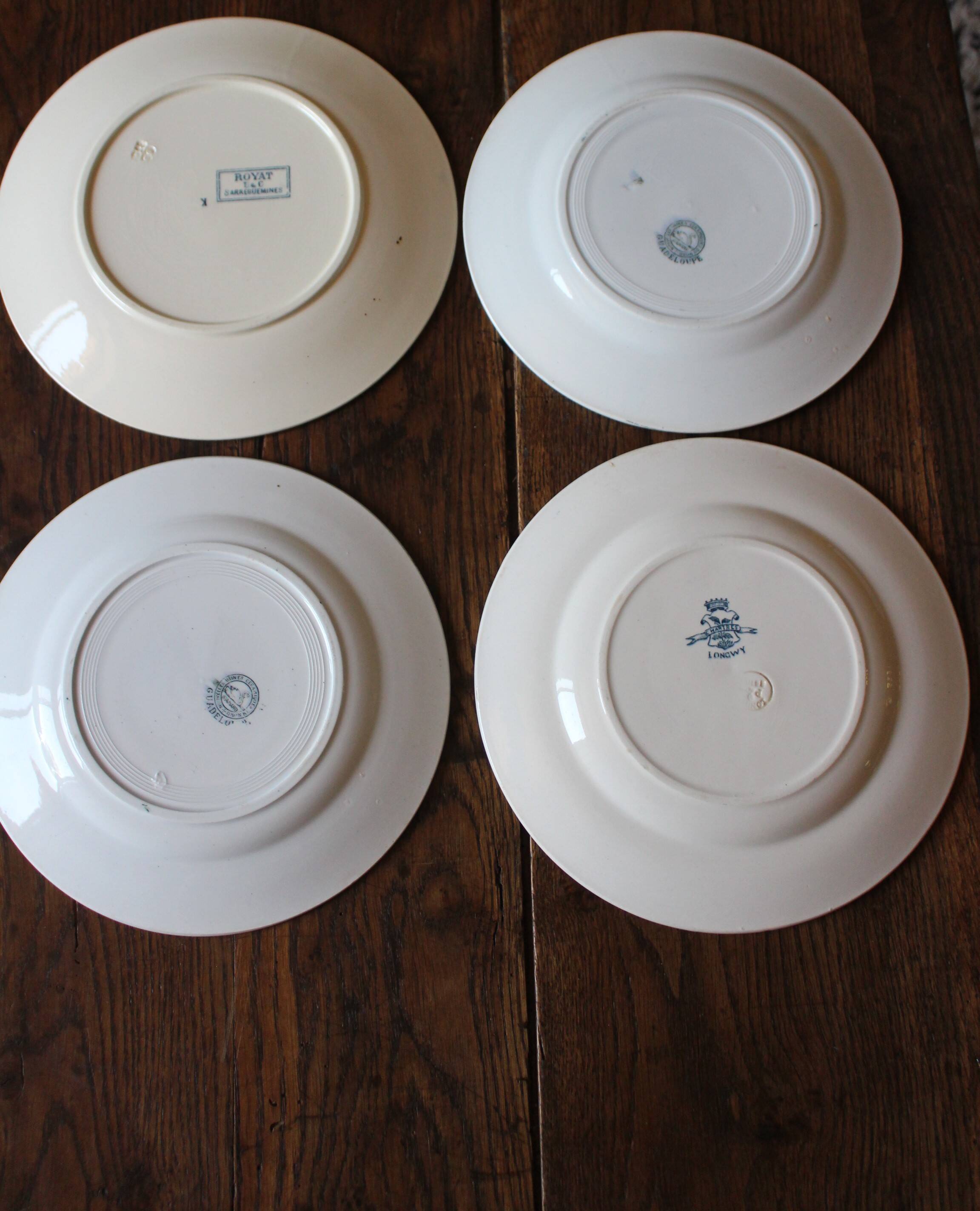 Set of 4 mismatched blue flat plates