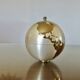 Large terrestrial globe, cigarette dispenser, brass, 1960 - 1970