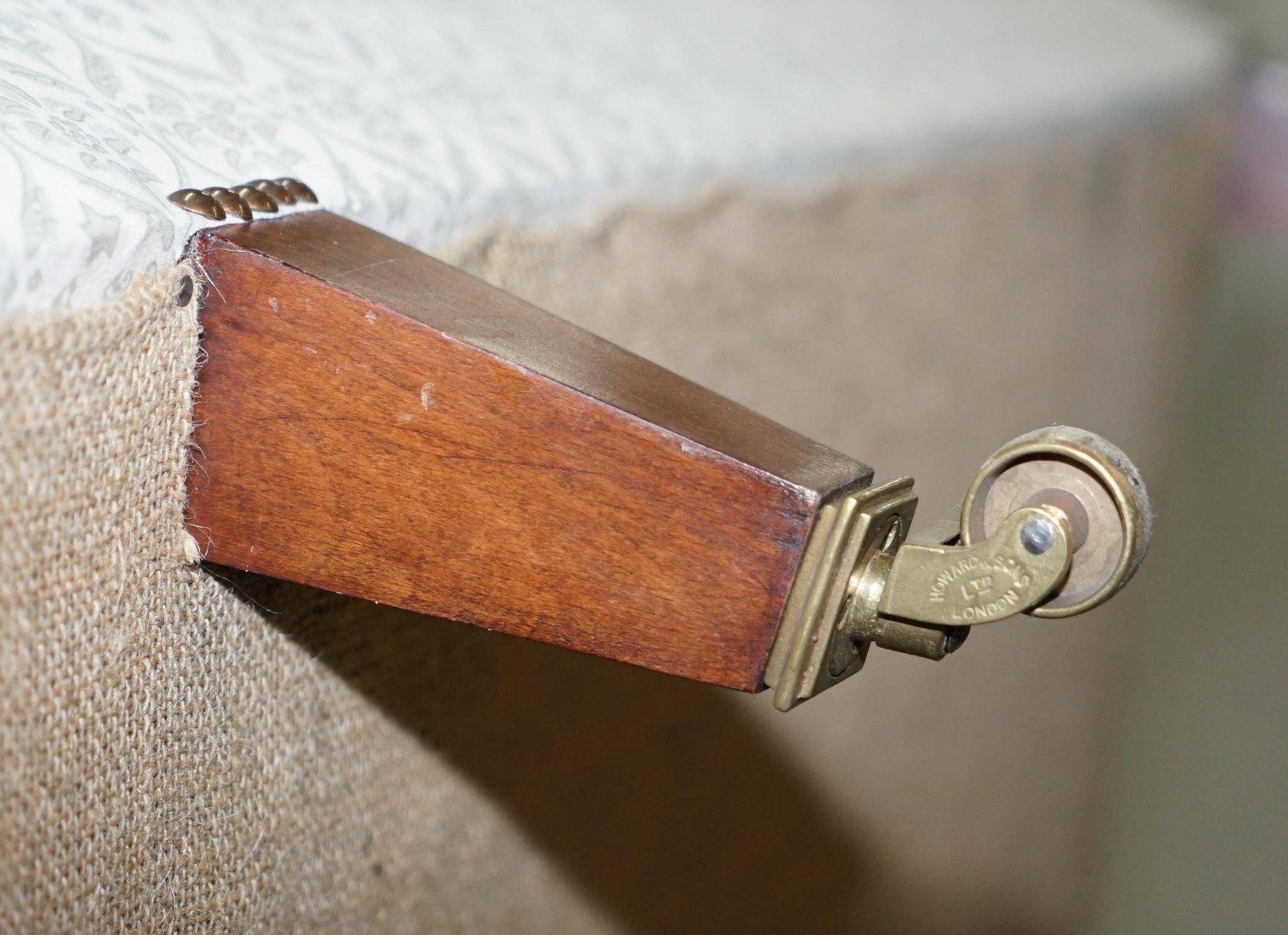 Howard & Sons canapé with feather cushions and ticking fabric, Victorian style.