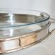 Oval Pyrex gratin dish, silver-plated metal stand.