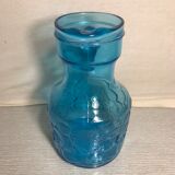 Blue moulded pitcher with decorative handle