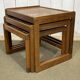 Set of 3 nesting tables in teak with tiled tops.