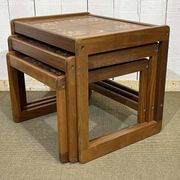 Set of 3 nesting tables in teak with tiled tops.