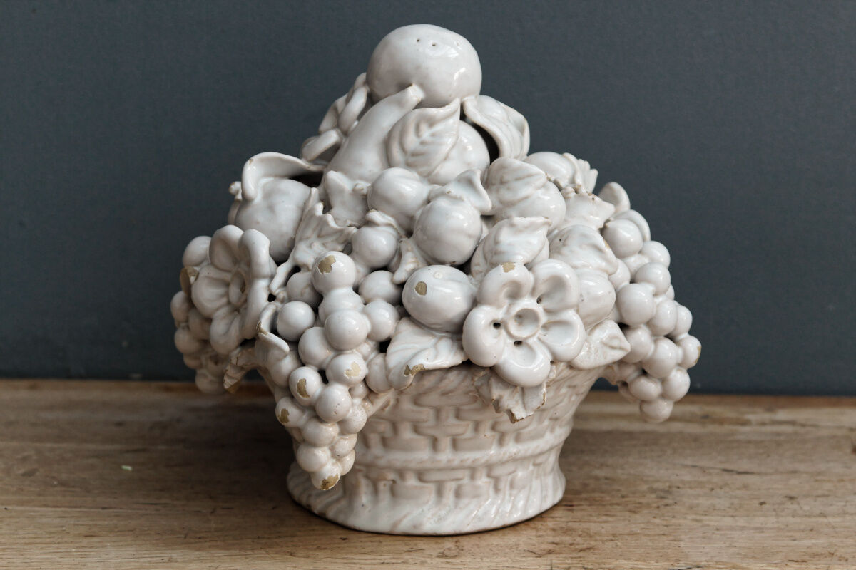 Ornamental basket decorated with trompe l'oeil fruits