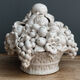 Ornamental basket decorated with trompe l'oeil fruits