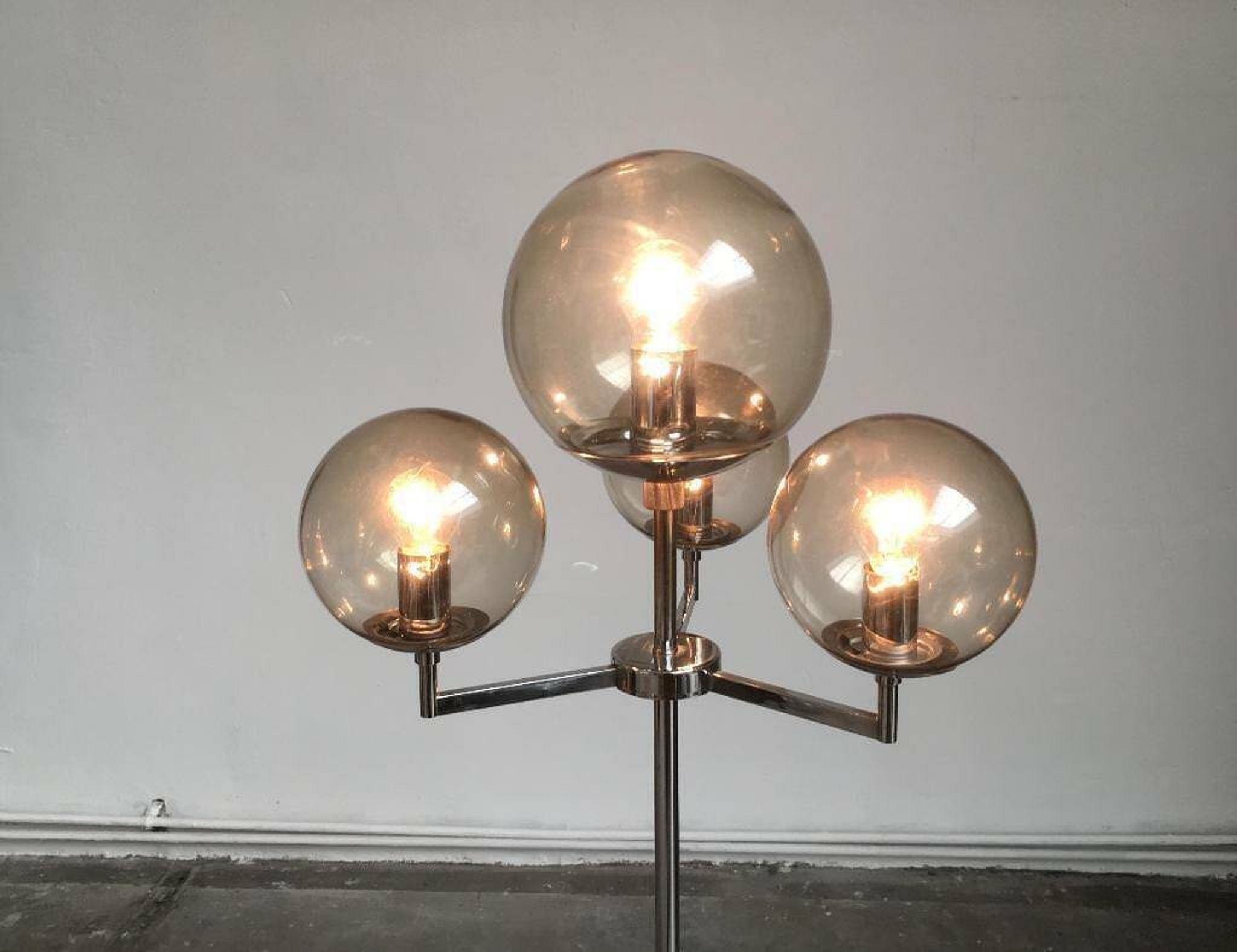 Chrome and glass floor lamp in mid-century German space style by Hustadt Leuchten, 1960s.