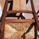 Pair of oak armchairs with straw seats and backs.