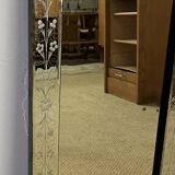 Venetian mirror with floral decoration pediment