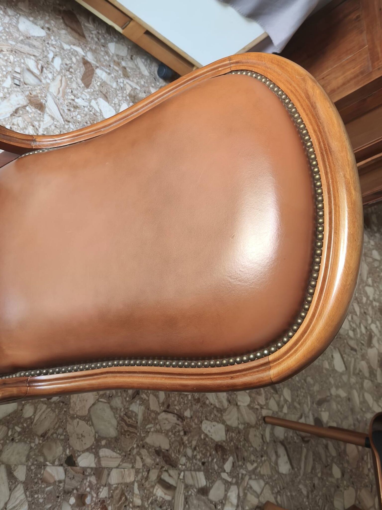 Leather armchair signed