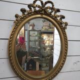 Oval mirror with gold patina