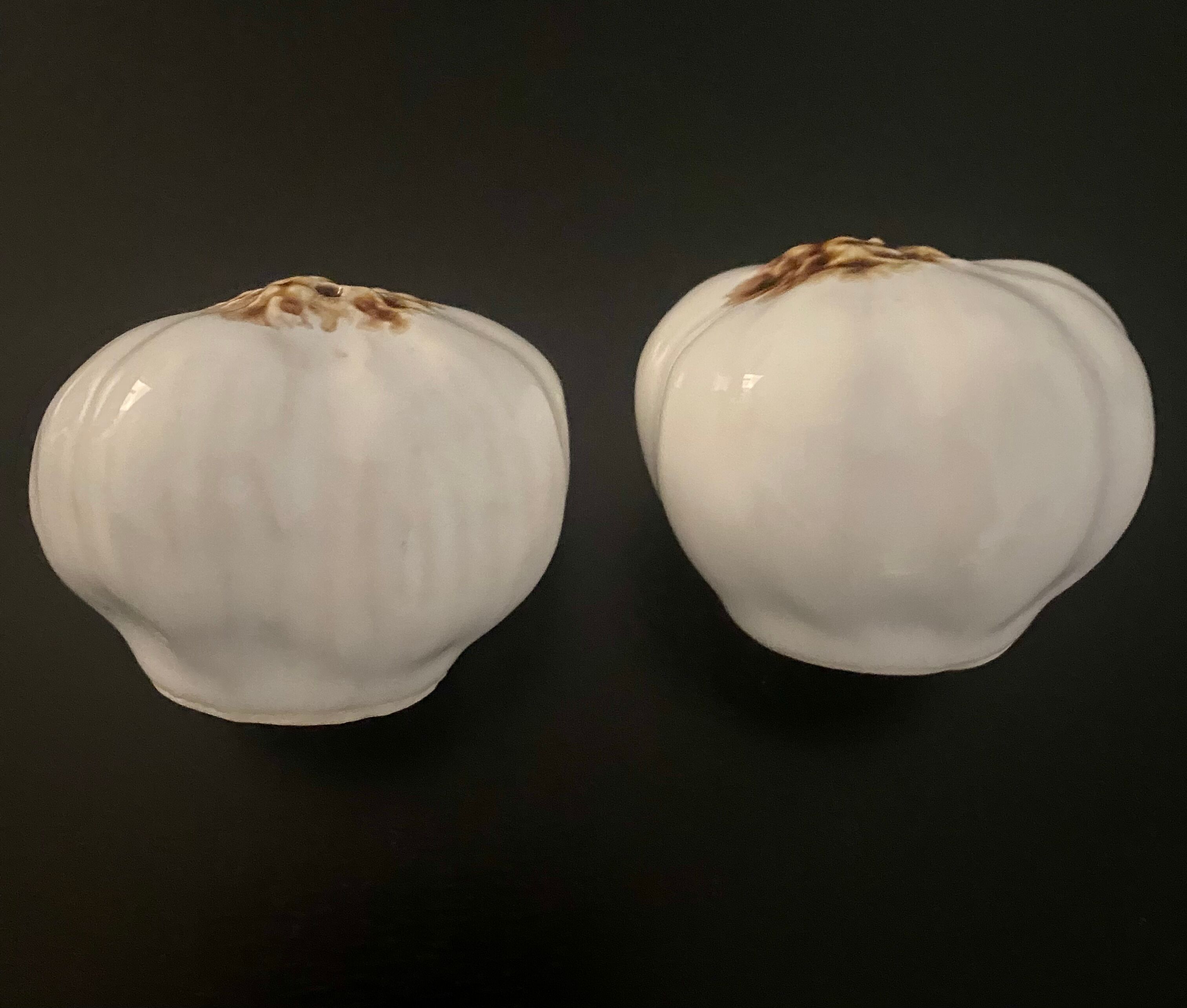 1 salt shaker and 1 pepper white garlic shape
