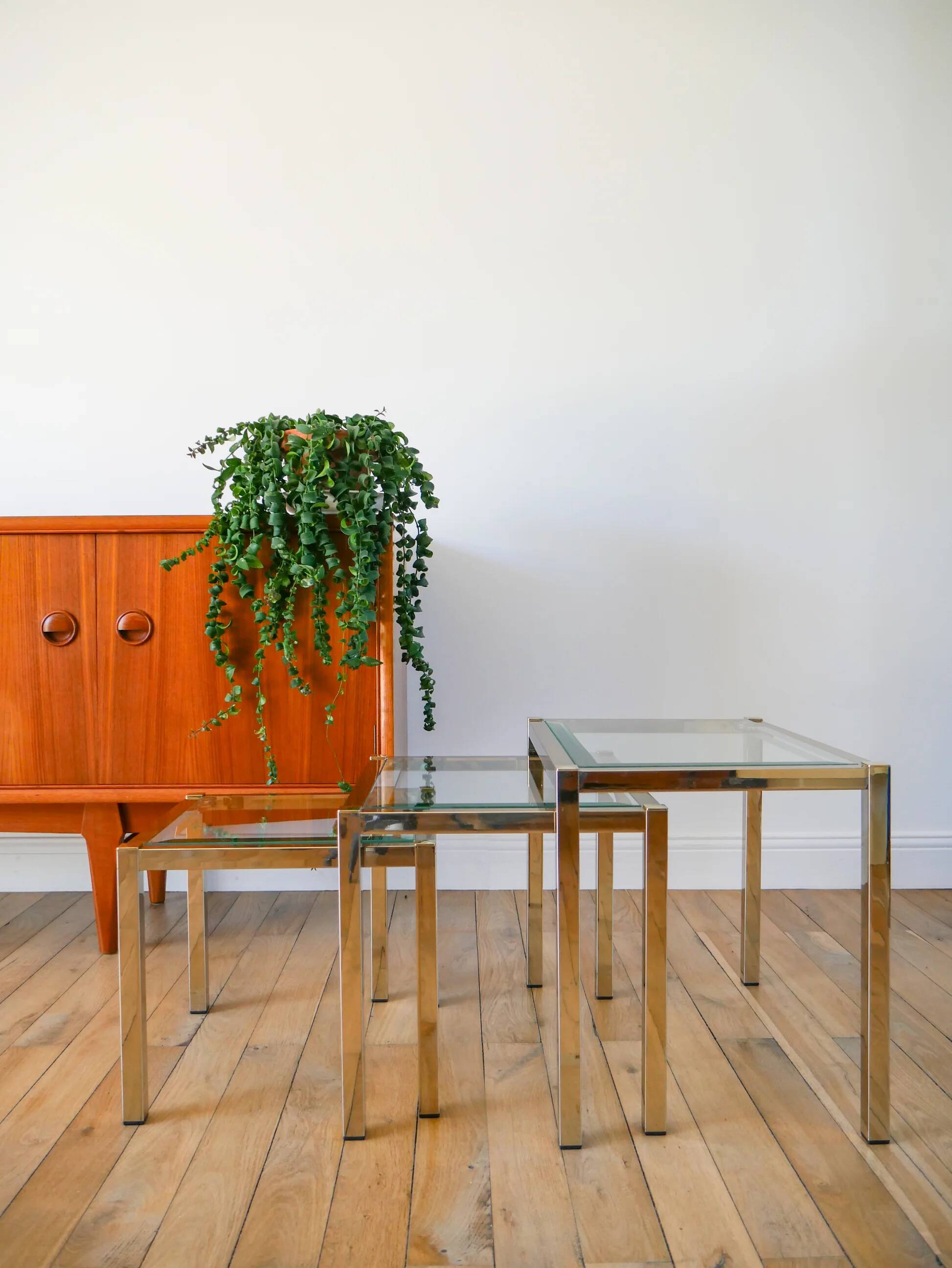 Set of three nesting coffee tables, gilt brass with beveled glass tops, 1980