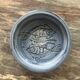 Glazed blue ceramic bowl with stylised fish decoration.
