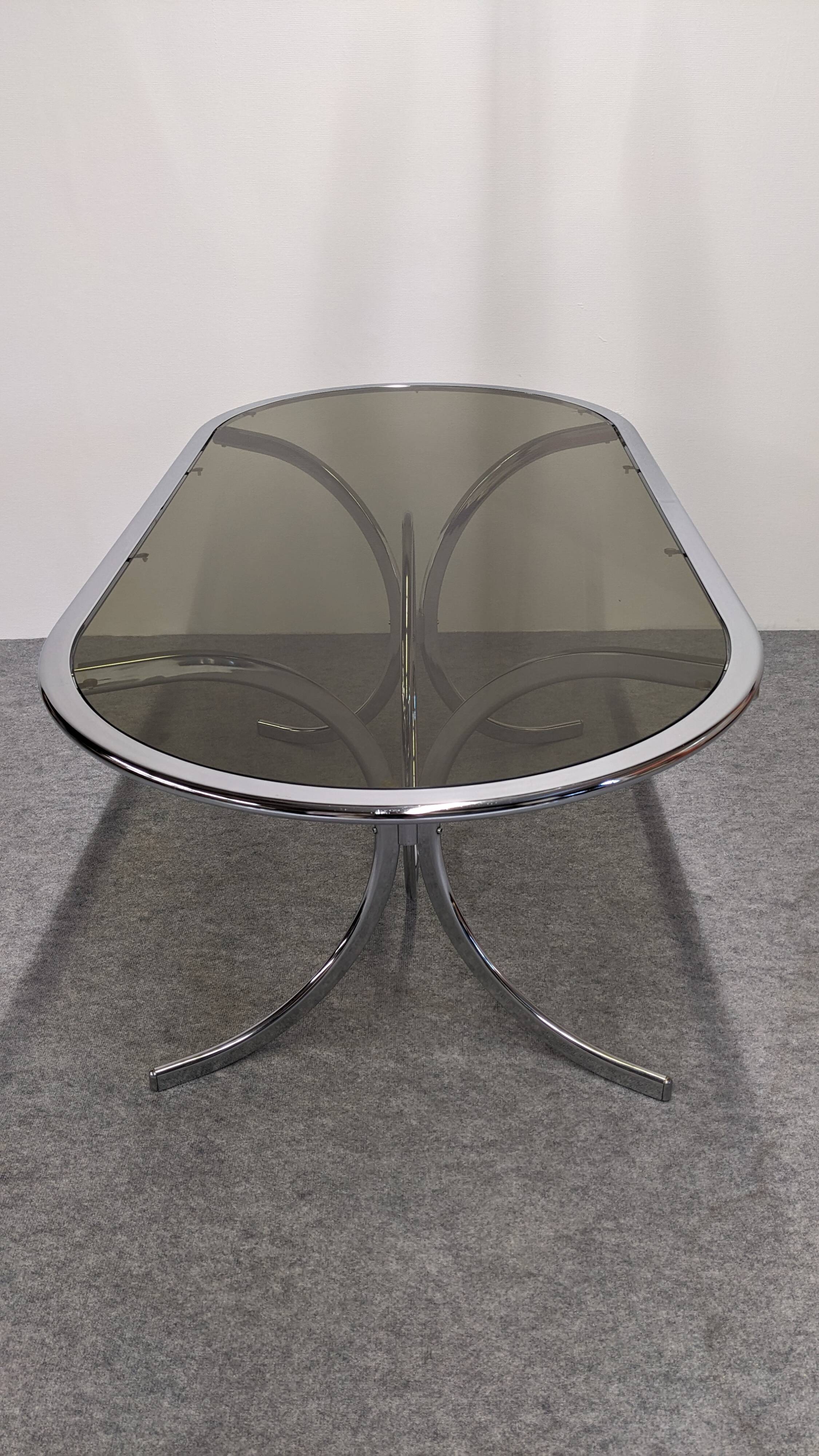 Chrome metal and smoked glass dining table, Italy circa 1970.