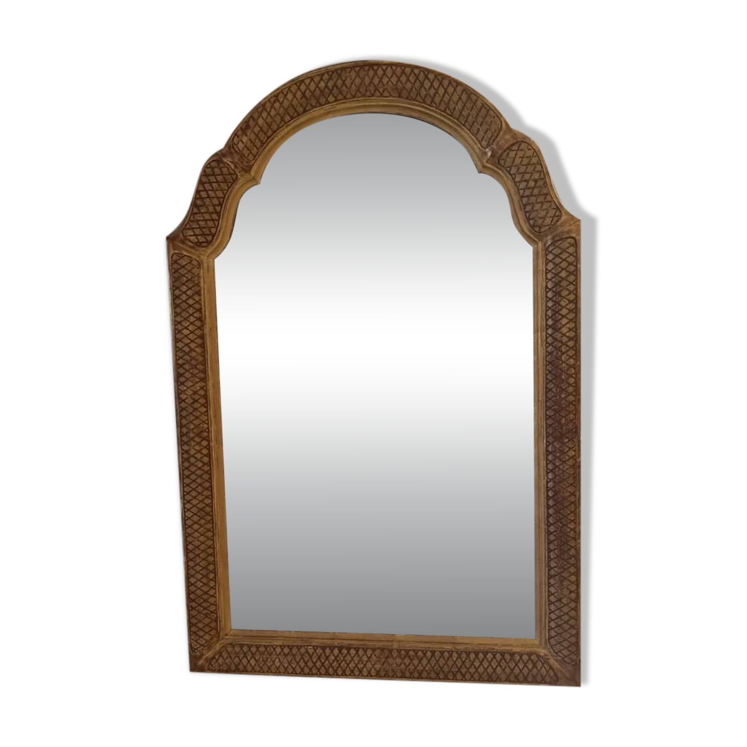 Italian mirror with a sculpted patinated arch, neo-Renaissance style.