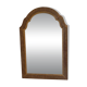 Italian mirror with a sculpted patinated arch, neo-Renaissance style.
