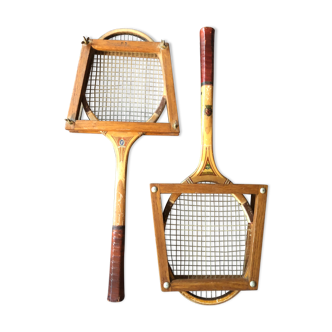 Pair of old wooden tennis rackets with 50s frames