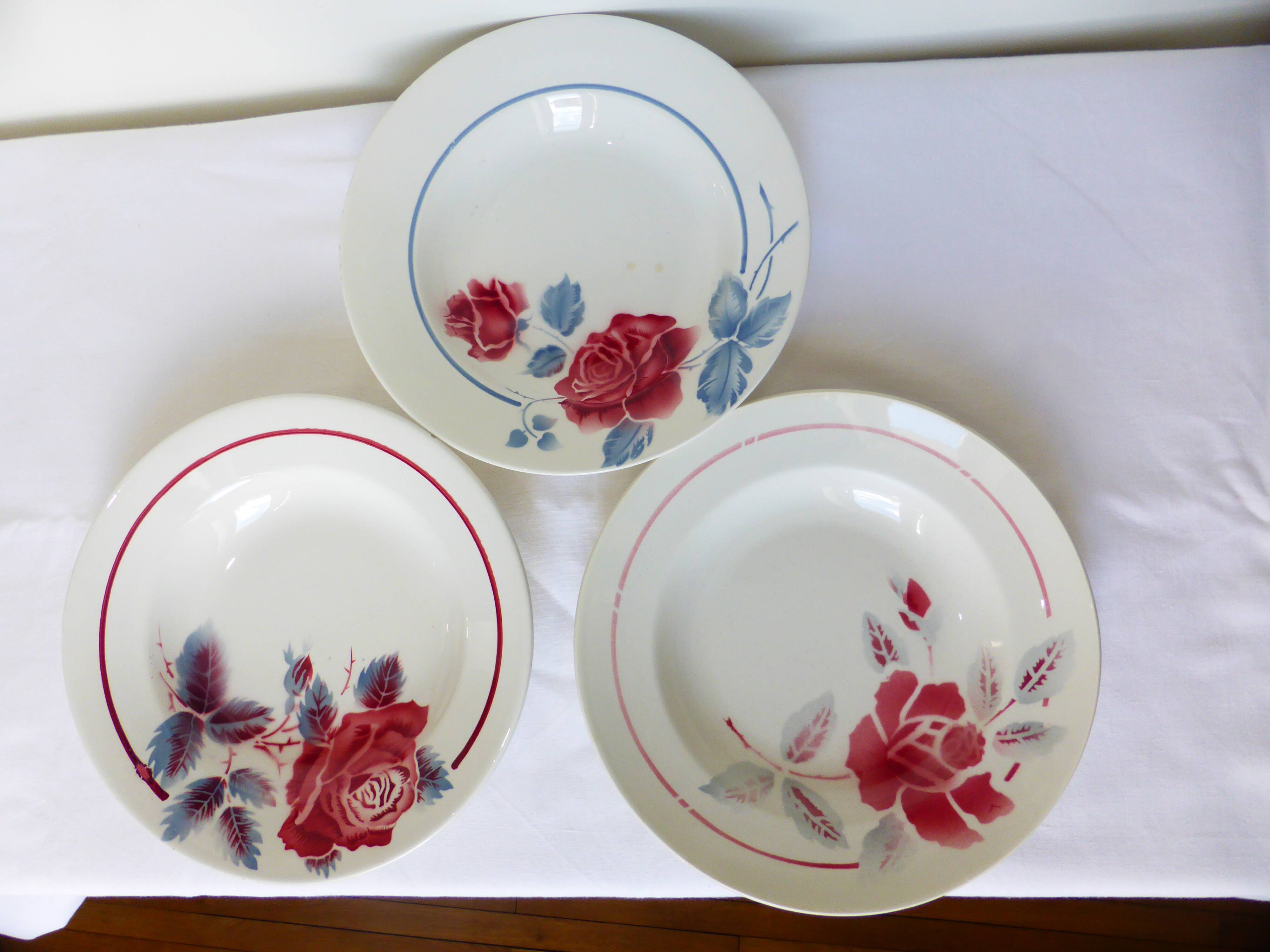 3 vintage soup plates in a jumble