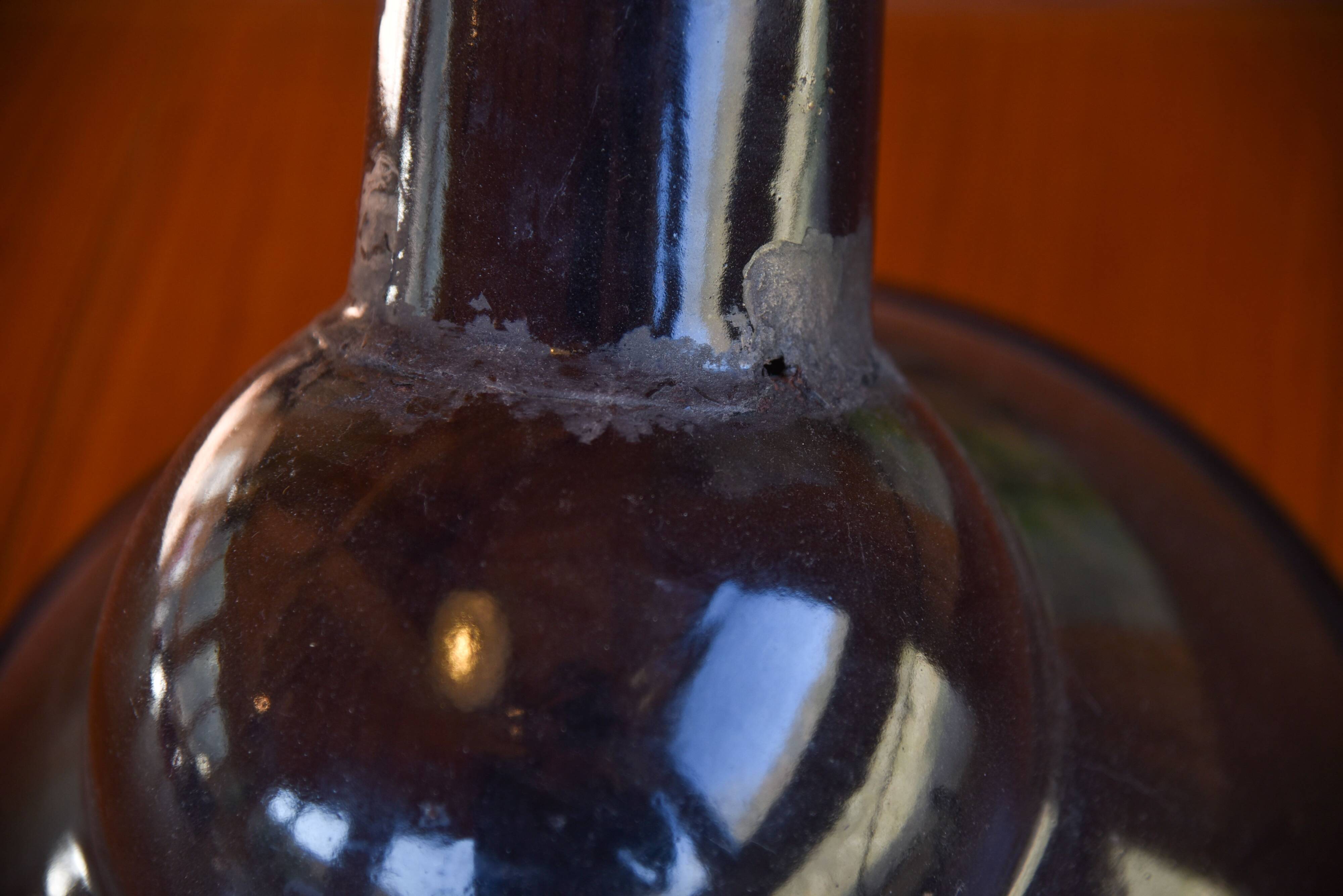 Pair of black enamelled sheet metal pendant lights from the 1950s.