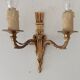 Vintage wall sconce in gilded brass, Empire style.