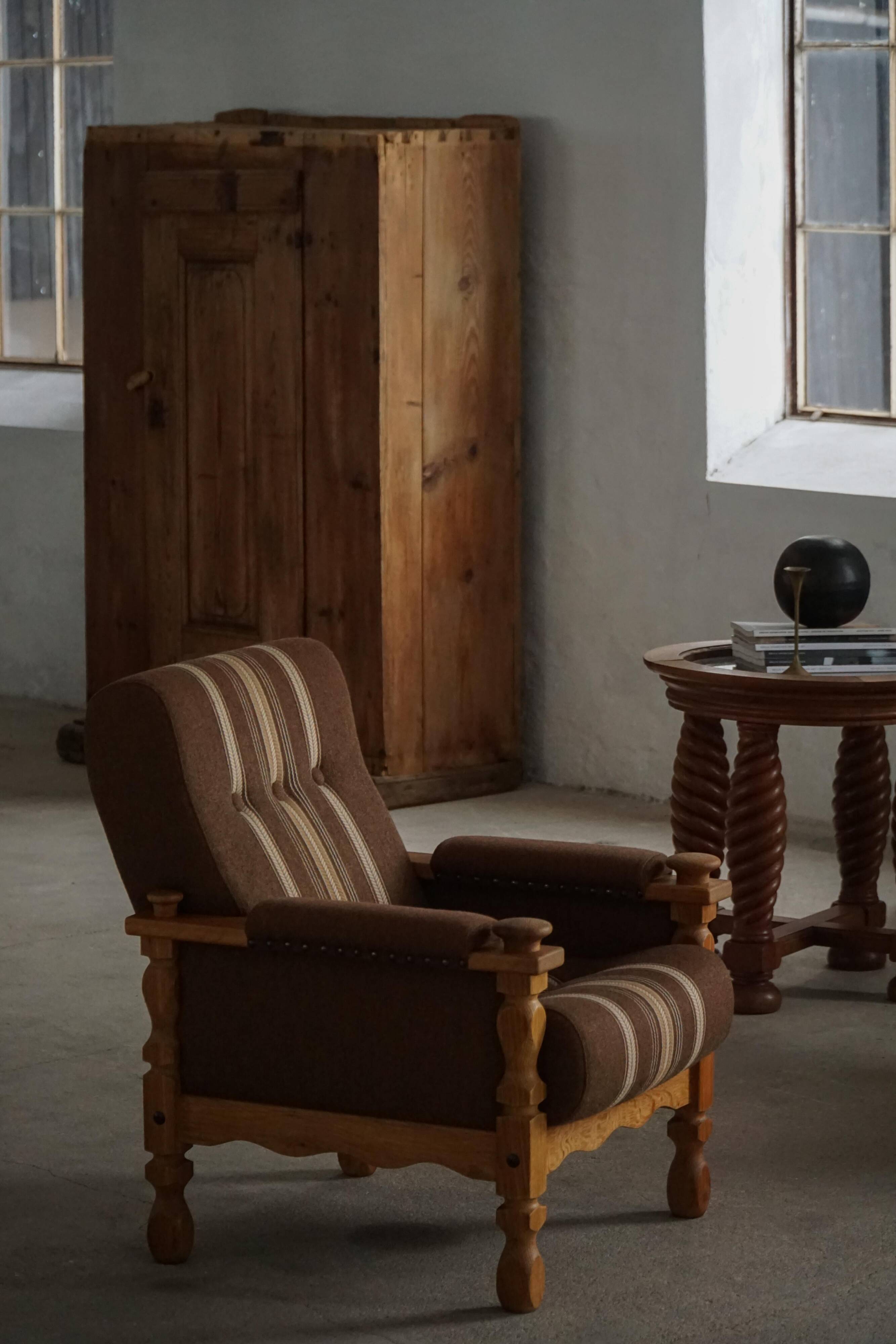 Modern Danish, a pair of lounge chairs in oak and wool, Henning Kjærnulf, 1960s.