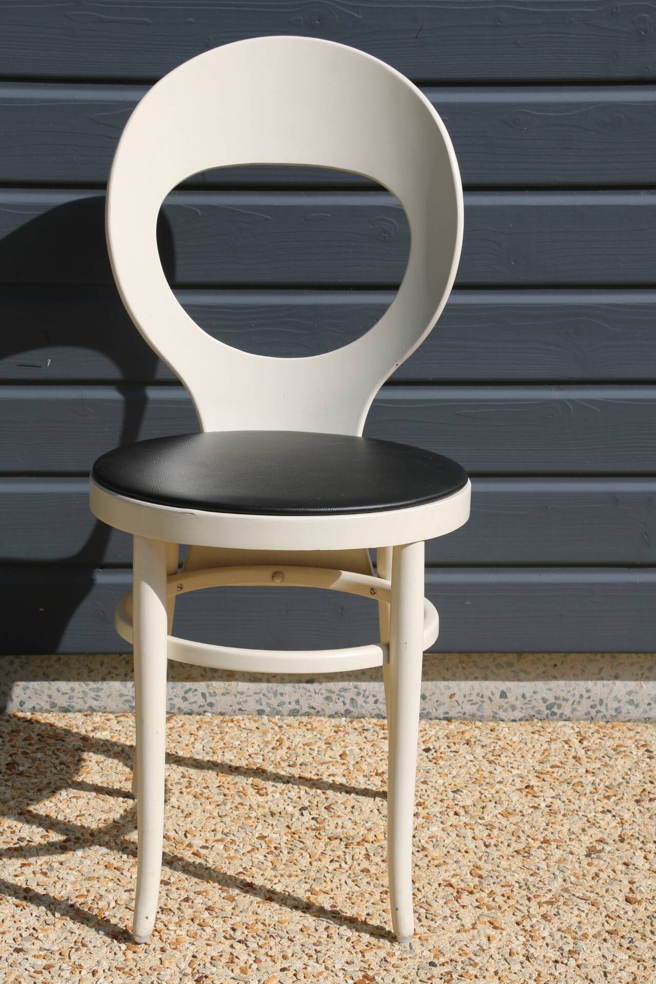 6 baumann chairs, white gull with black faux leather.